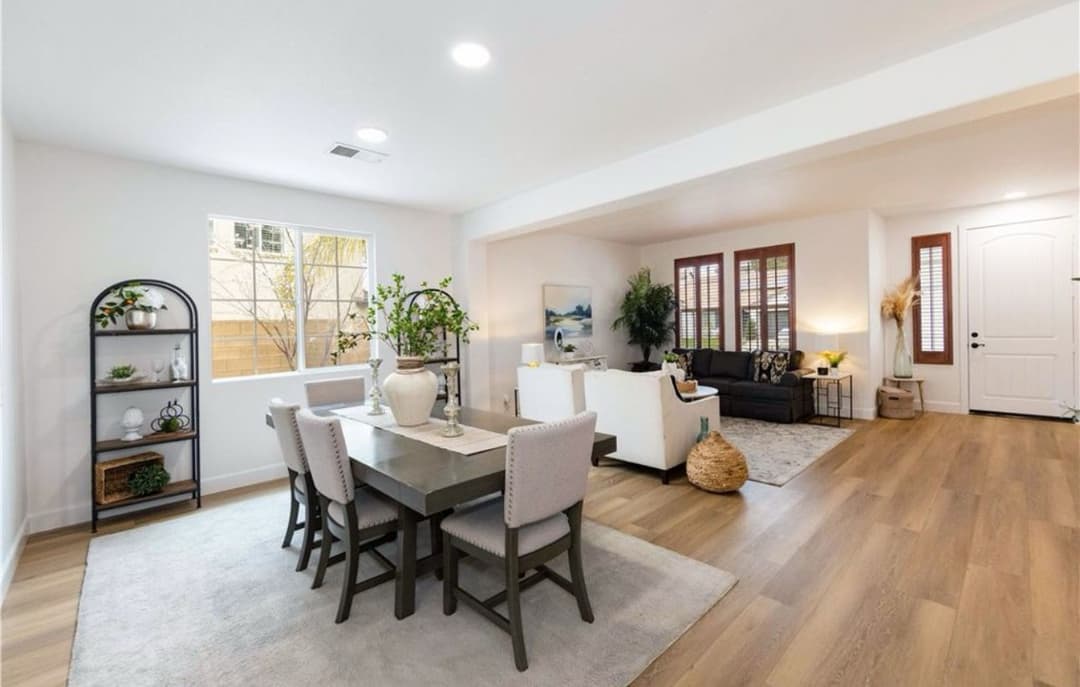 Modern open-concept living room and dining area with stylish decor and natural light.