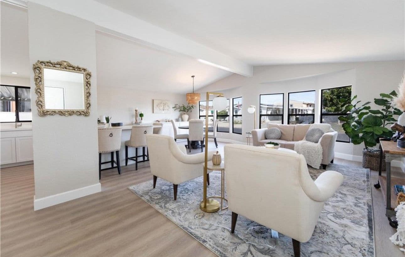 Modern living room with chic furniture, elegant decor, and open layout featuring natural light.